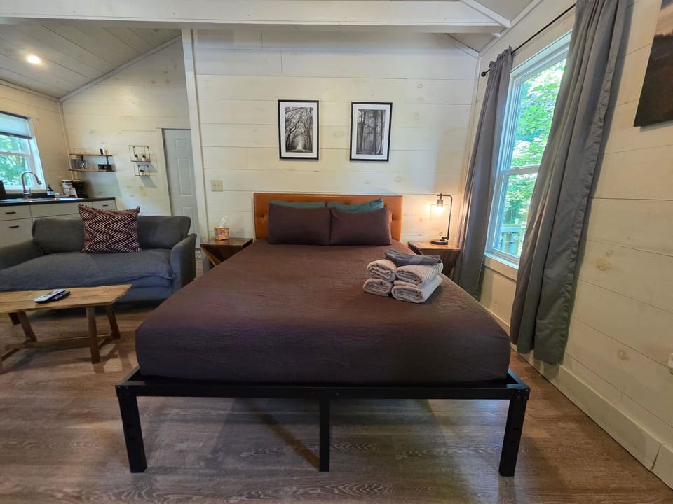 Queen bed by the window