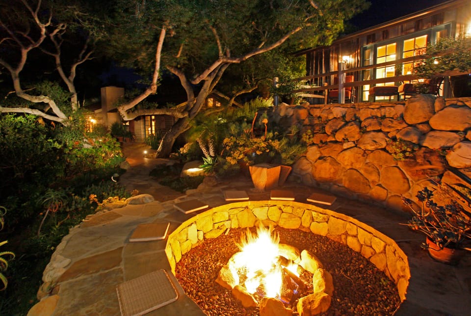 Guest Cottage terrace has views of the firepit and coastline.