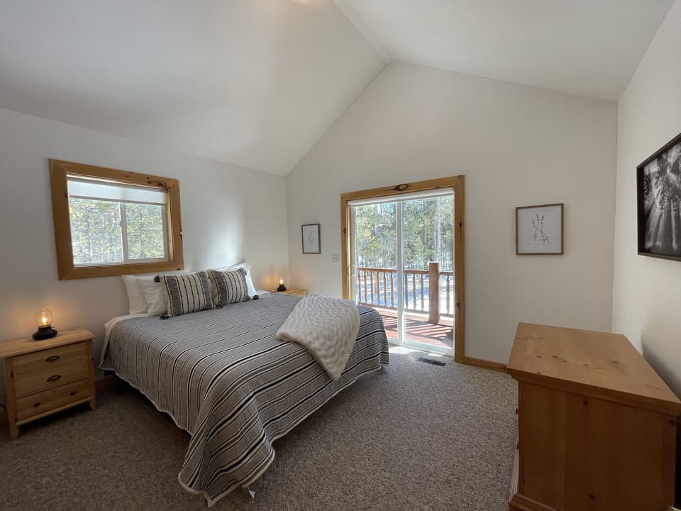 Upstairs bedroom with king bed and walk out balcony