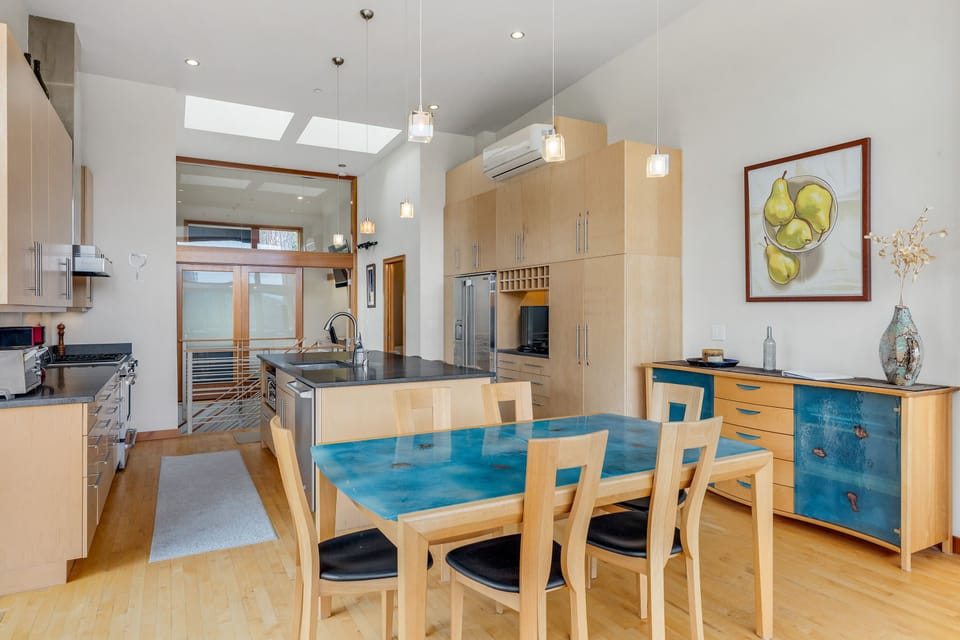 Well appointed kitchen and a dining table with comfortable seating for 6