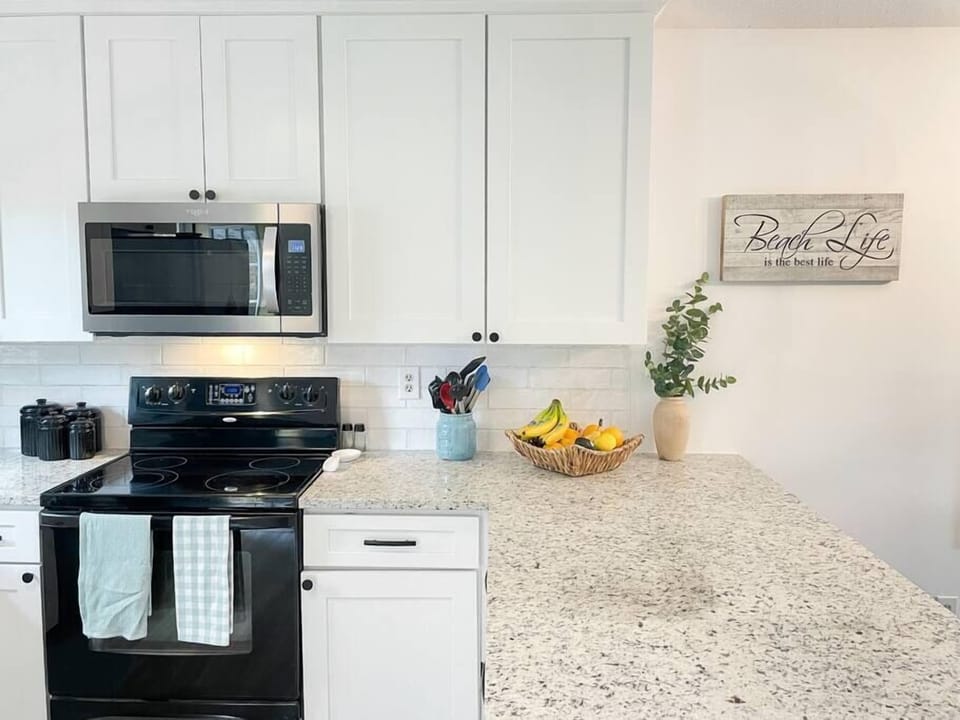 Main floor fully functioning kitchen with dishwasher and other appliances. (1)