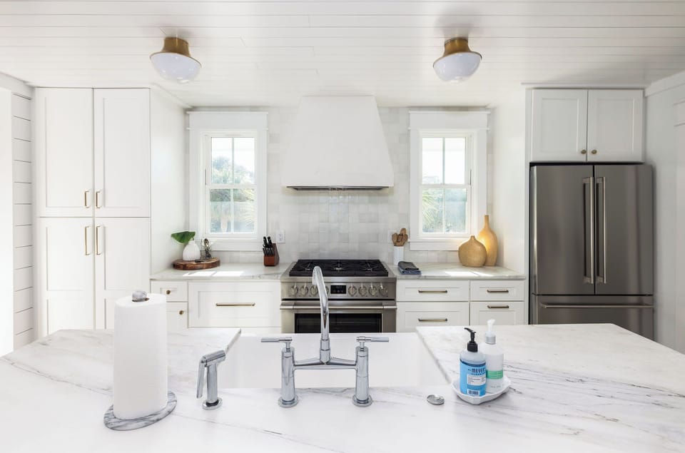 Bright and airy kitchen with quartz counters, custom finishes, and plenty of seating for gathering