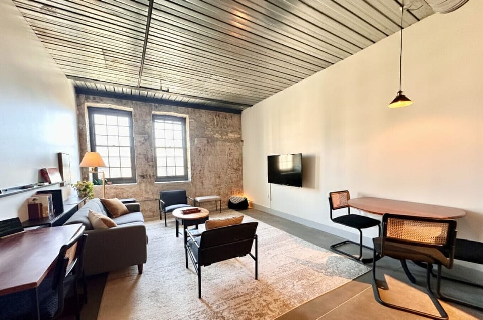 Spacious living room with dedicated workspace and dining table/flex workspace