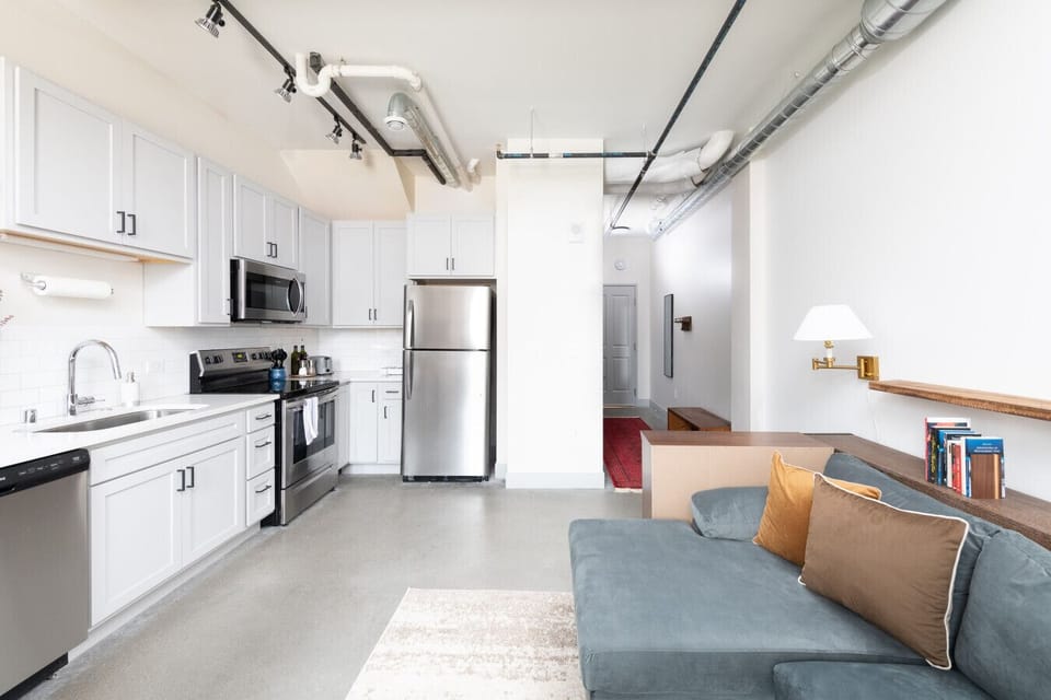 A fully equipped kitchen with sleek cabinetry and modern appliances—perfect for whipping up a quick breakfast or a gourmet dinner
