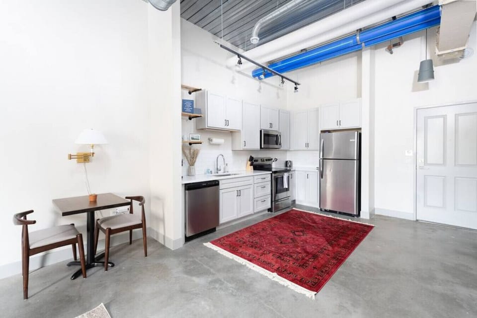A fully equipped kitchen with sleek cabinetry and modern appliances—perfect for whipping up a quick breakfast or a gourmet dinner