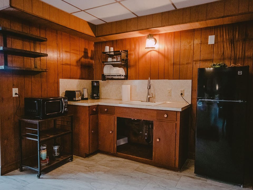 Apartment equipped w/ refrigerator, microwave, Keurig coffee maker, dishware.