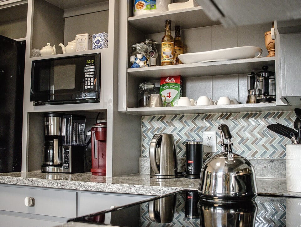 Keurig & drip coffee, milk frother, kettle, & blender for your convenience.