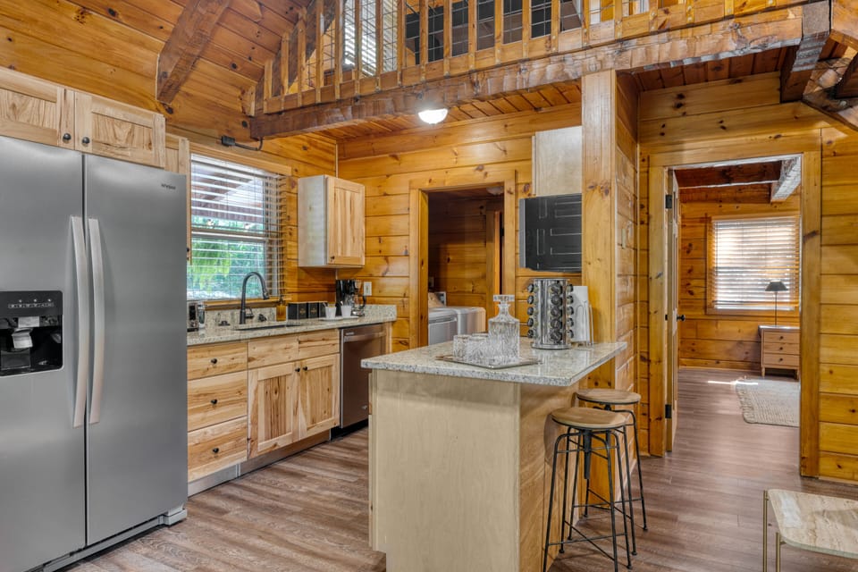 Rustic kitchen with barstool seating.