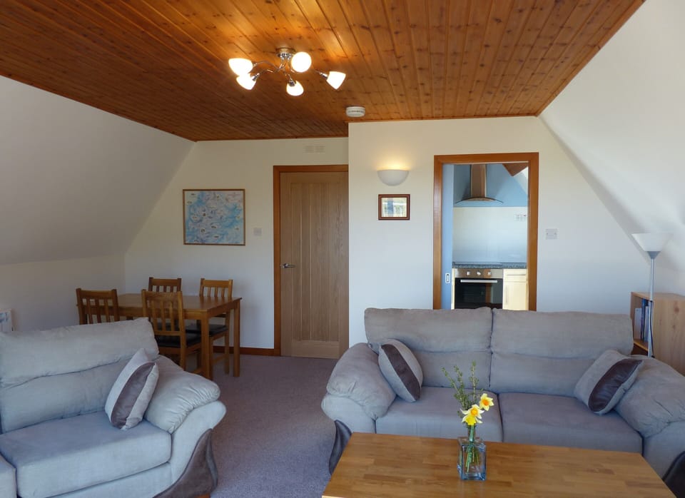 Living/Dining Room, access to the kitchen, some books, games, maps, information