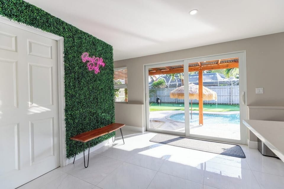 Our hallway blends indoor comfort with outdoor allure, guiding you to the pool. Check it out & secure your getaway!