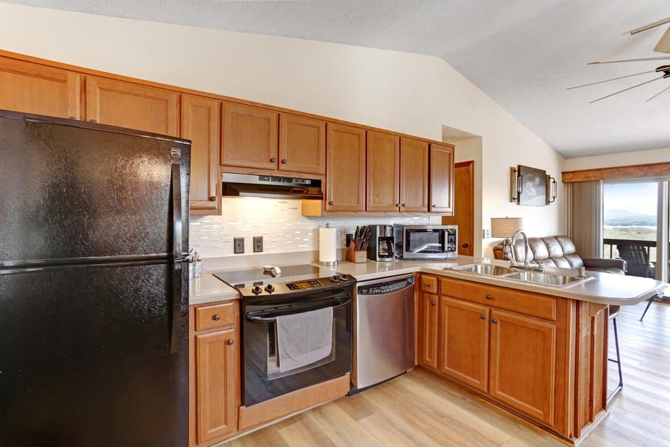 Well equipped kitchen with cutlery, pots and pans and 12 cup coffee maker.