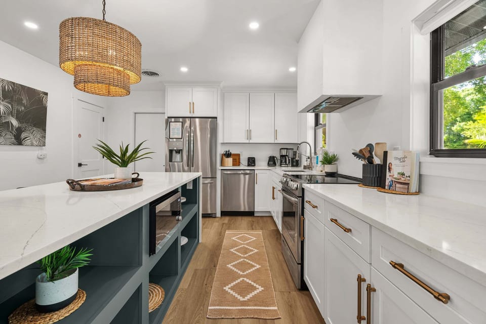 Waterfall countertops, new stainless steel appliances, and such an incredible kitchen island! You'll be cooking in luxury!