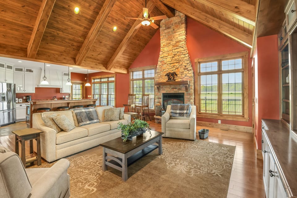 Cozy lounging space with big stone fire place right next to the kitchen!