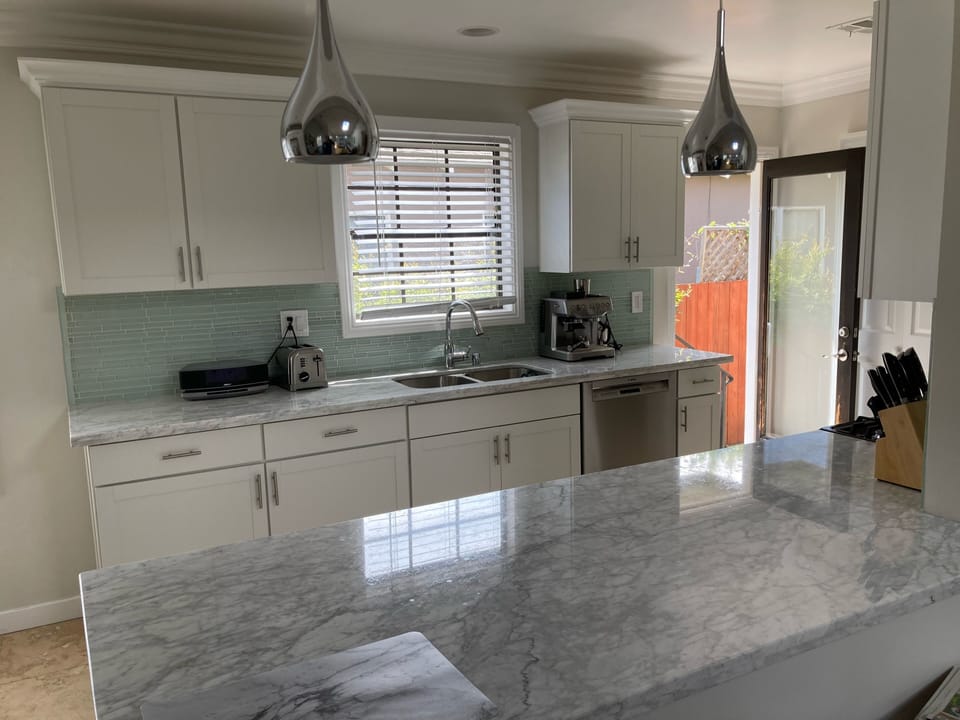 Kitchen with door to side yard