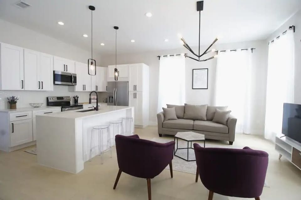 Comfortable, open living room and full kitchen.