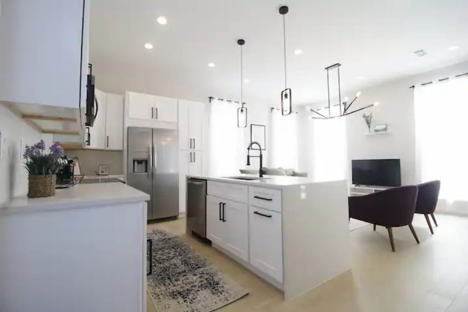 Full kitchen, dishwasher, full stove/oven, microwave, and side-by-side fridge.