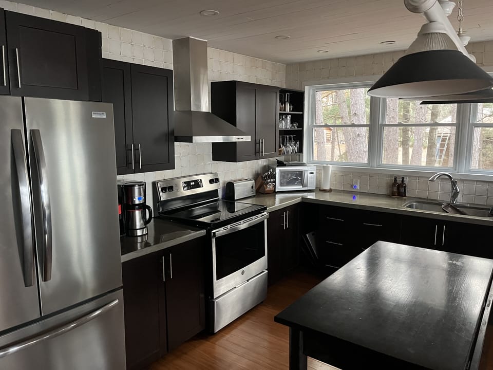 Kitchen stocked with essentials, including coffee maker and Nespresso vertuo