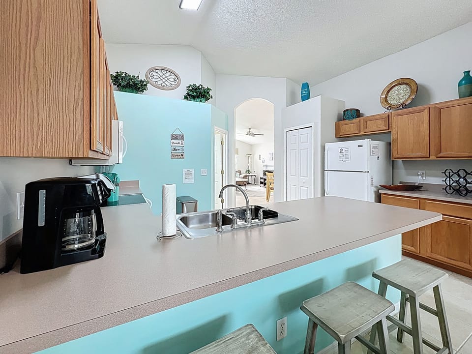 In addition to table seating, there are 3 stools at the kitchen counter