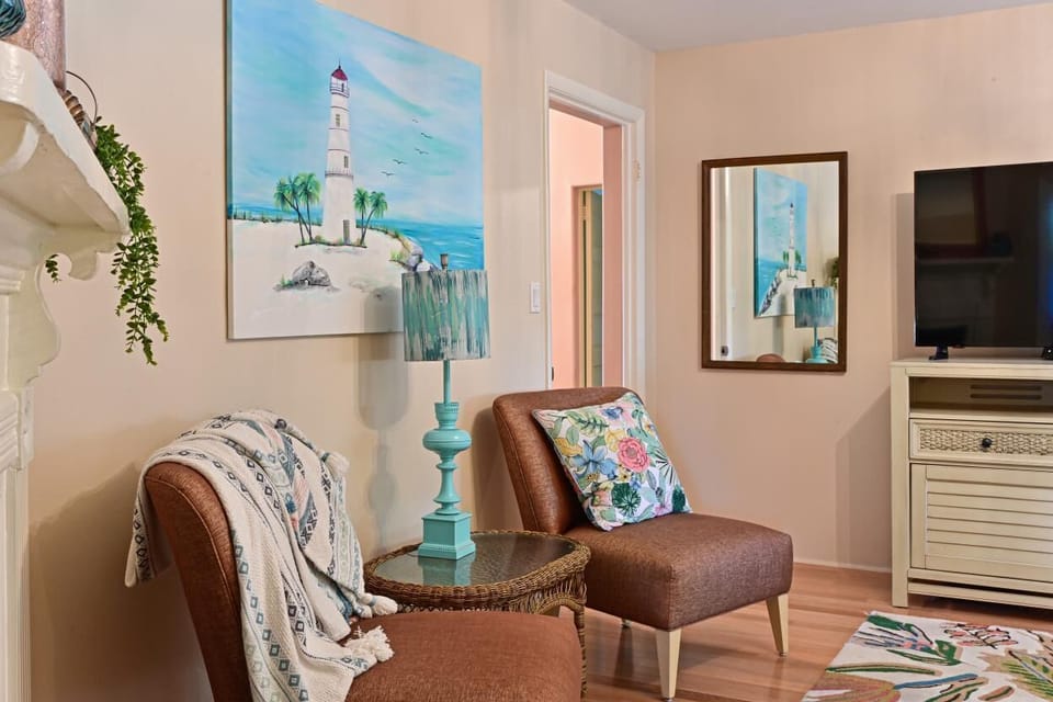 The living room is straight ahead as you walk through the foyer.