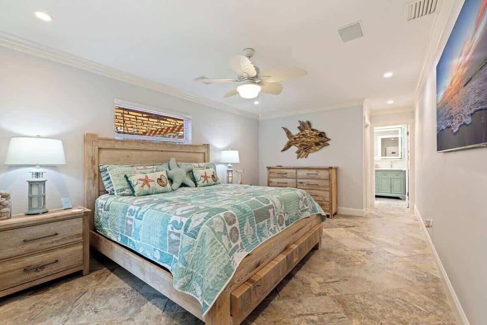 Relax in the spacious master bedroom featuring a plush king-size hybrid memory foam mattress. Unwind in comfort and stream your favorite shows, creating the perfect end to a day spent enjoying the coast.