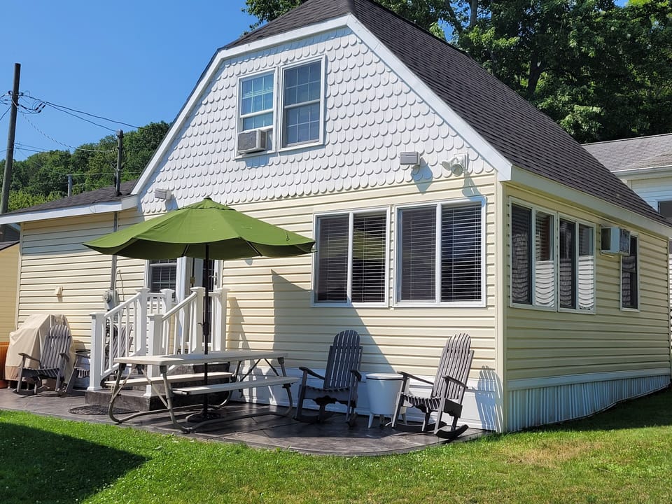 From the chairs on this patio you can sit and watch the lake. 