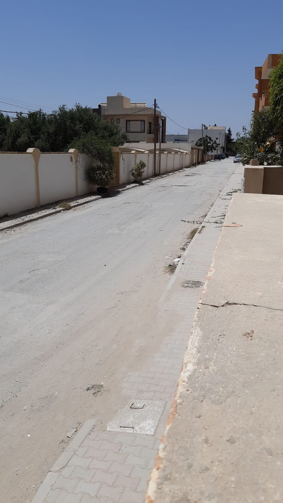 street outside compound, southside.  Free parking under CCTV.