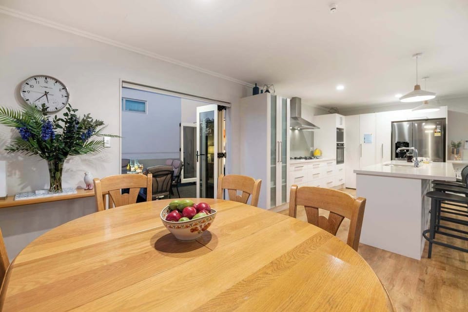 Dining and kitchen with patio in background