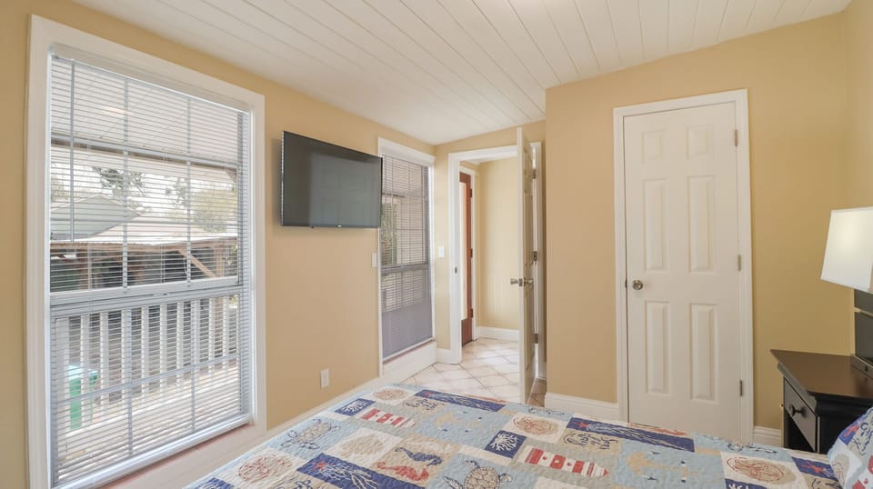 Queen bed with large flatscreen tv