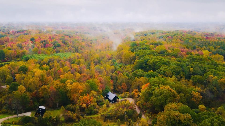 An aerial view of proximity from The Lodge (far right) to The A-Frame (front left). The two cabins are both situation on our 10 acre property.