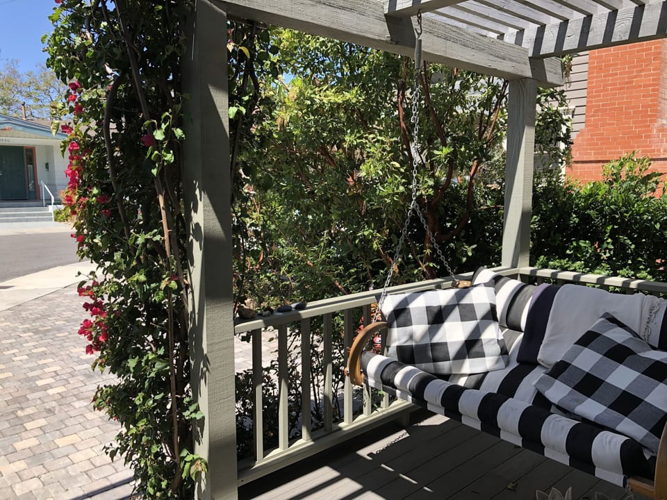 Old-fashioned Swing under the Pergola