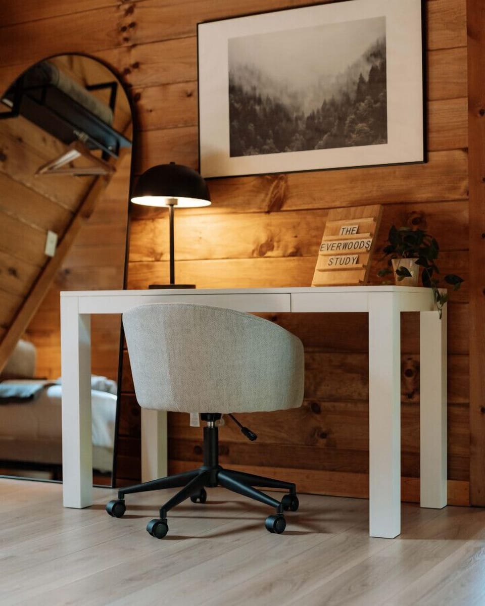 A dedicated office space just to the right of the loft bed area.