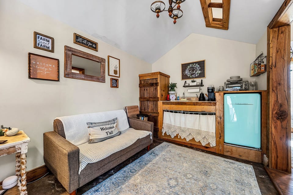 A simple kitchenette with a compact refrigerator to keep some items cool. 