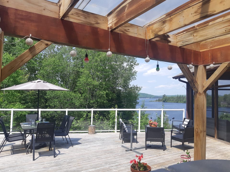 Large deck. Screened in sunroom. 
