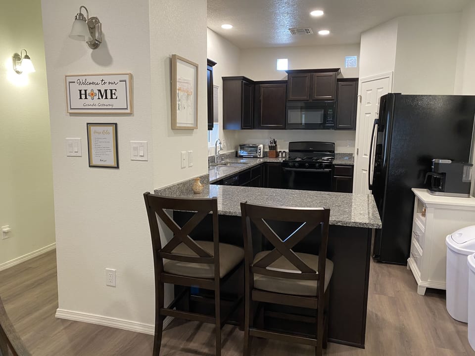 Kitchen with seating at the bar.