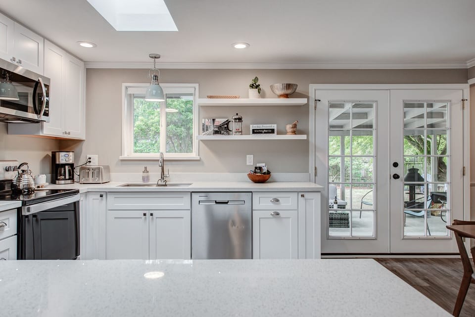 Remodeled kitchen opens up to back yard and patio