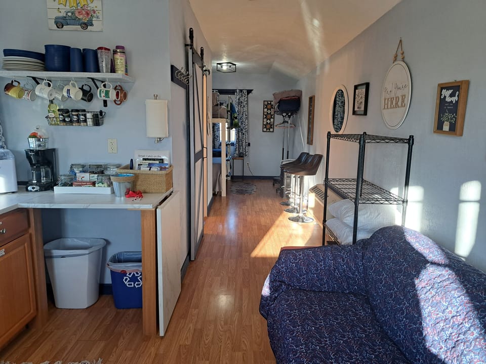 The end of the counter pulls up to make a table and folds down to save room.