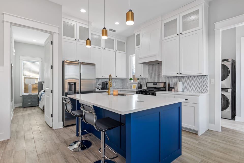 Oversized kitchen island has two additional seats for dining !