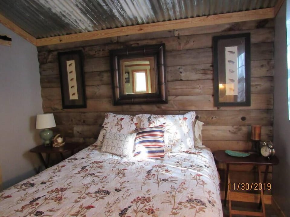 Master bedroom with queen size bed.