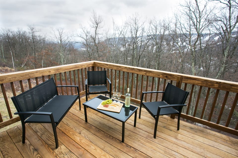 A small seating area on the balcony is a perfect place to enjoy the views.