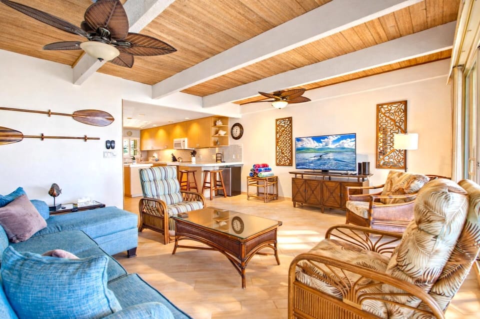 From your sofa, watch waves roll in through expansive glass doors that connect indoor comfort with fresh ocean air.