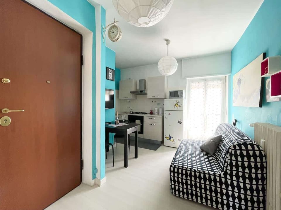 Living room with kitchenette, flat screen TV, sofa bed (French size) and large terrace 