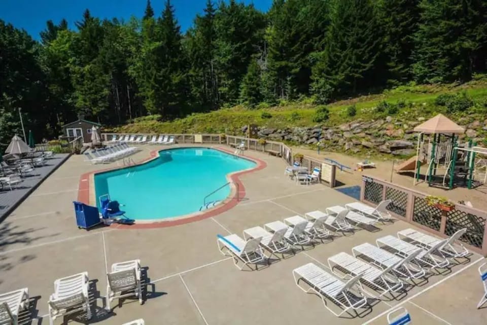 Clubhouse outdoor heated pool and sandy play area