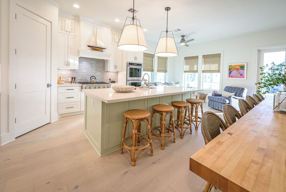 Fully equipped kitchen with double ovens, gas cooktop and island seating
