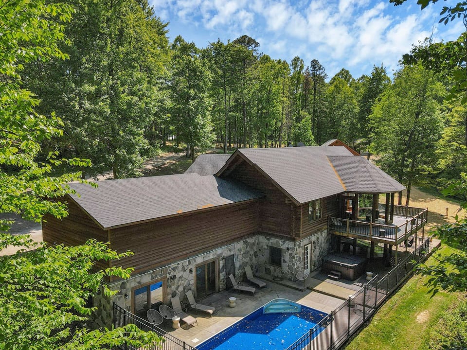 Our outdoor area features a pool, hot tub, wraparound porch, firepit and more! 