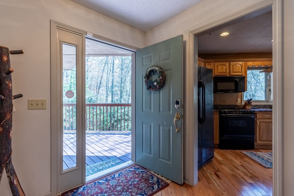 Entryway into the home with coat rack