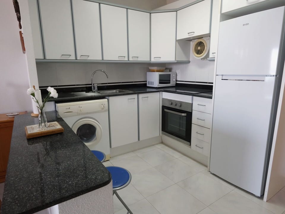 Cabinetry, Countertop, Property, Kitchen Stove, Kitchen Appliance, Sink, Home Appliance, Cooktop, Kitchen Sink, Kitchen