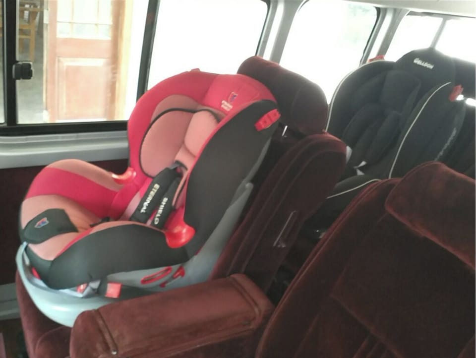To hire a 12 seat coach and two car seats with English speaking driver available