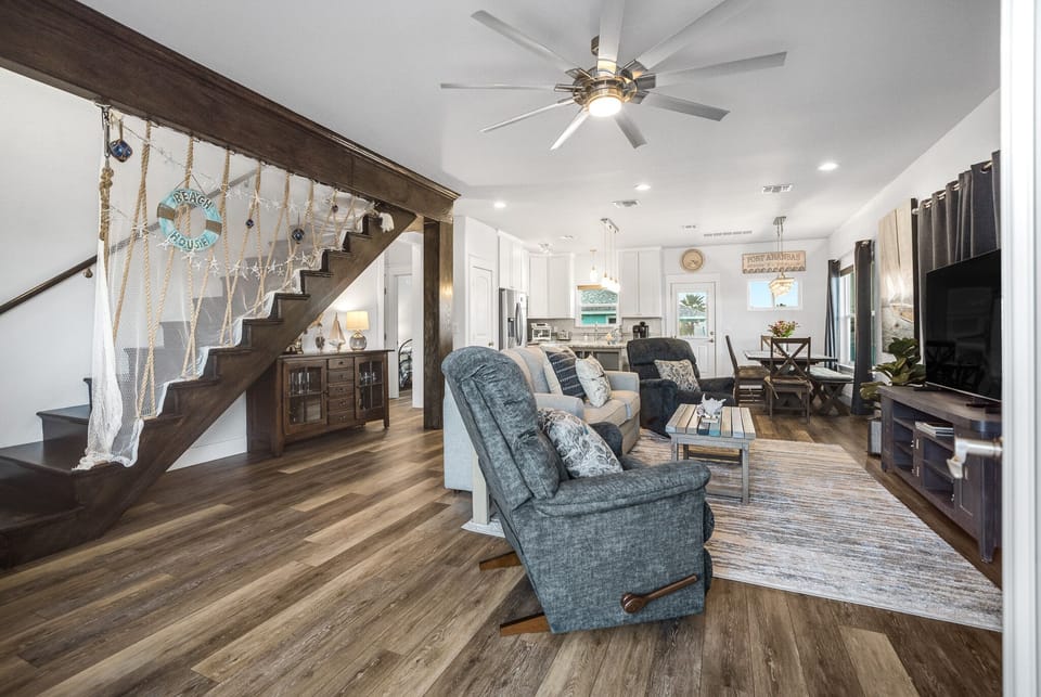 2nd Floor - Charming Living Area with Stairway Views and a Touch of Nautical Flair