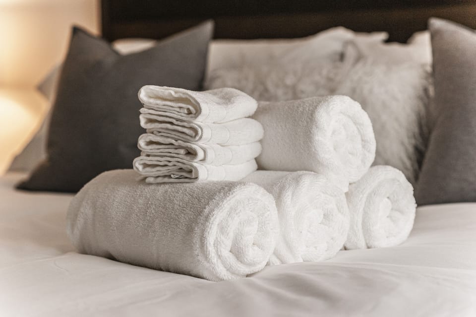 4 towels and 4 wash cloths per bathroom provided.