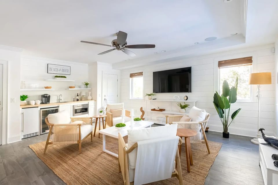1st Floor Living Room including large screen TV, Beverage Refrigerator, Ice Maker, Microwave, and sink.  Also has a full bathroom off the side for easy access from the pool.